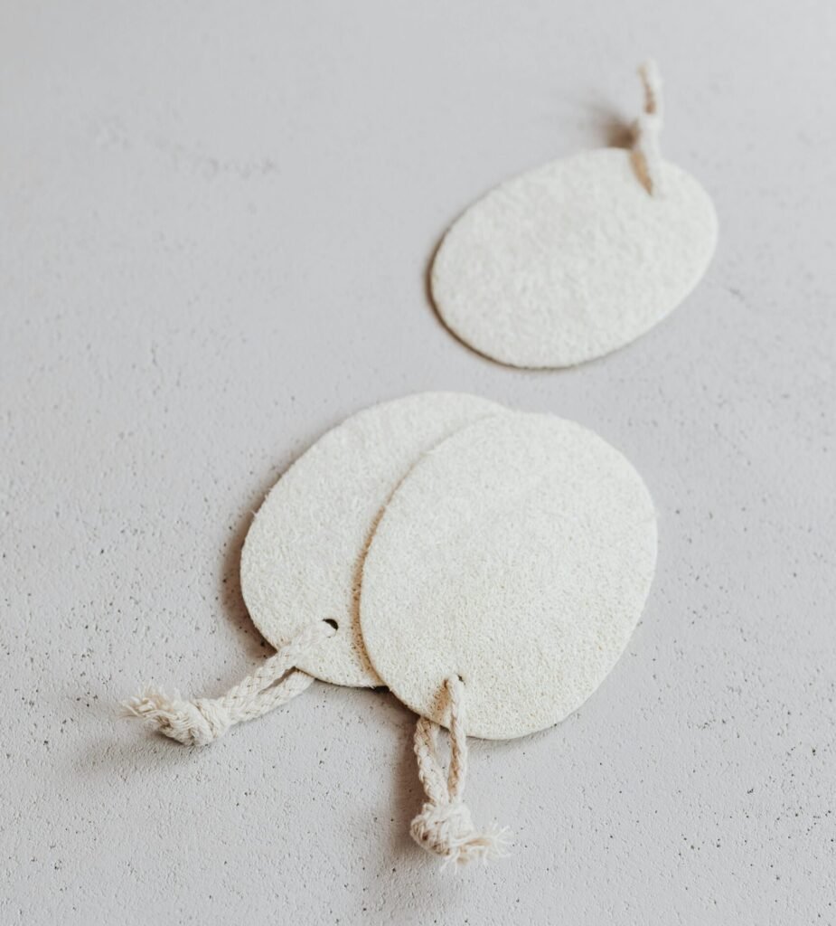 Minimalist shot of pumice stone scrubbers on a neutral background, perfect for spa or beauty themes.